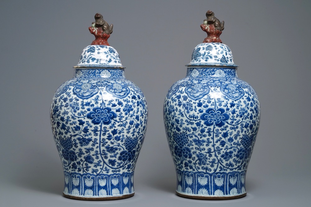 A pair of Chinese blue and white vases with faience replacement covers, Kangxi