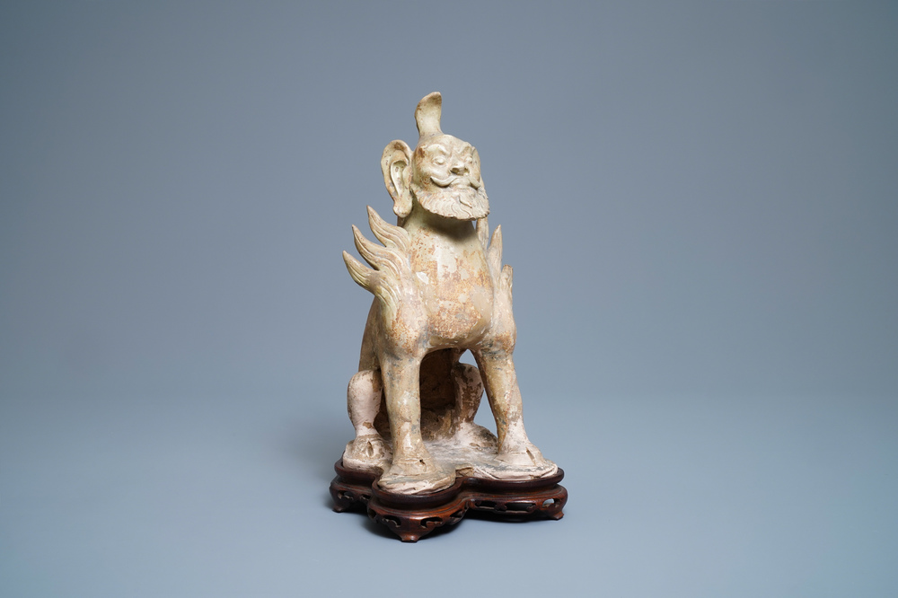 A Chinese straw-glazed stoneware 'earth spirit', Sui (581-617)