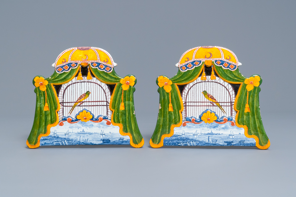 A pair of polychrome Dutch Delft trompe l'oeil birdcage plaques, 19th C.