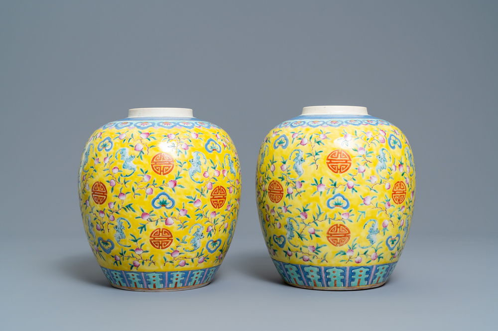 A pair of Chinese yellow-ground famille rose 'bats and shou' jars, Qianlong mark, 19th C.