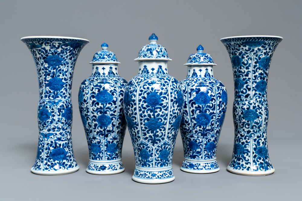 A Chinese blue and white five-piece garniture with floral design, Kangxi