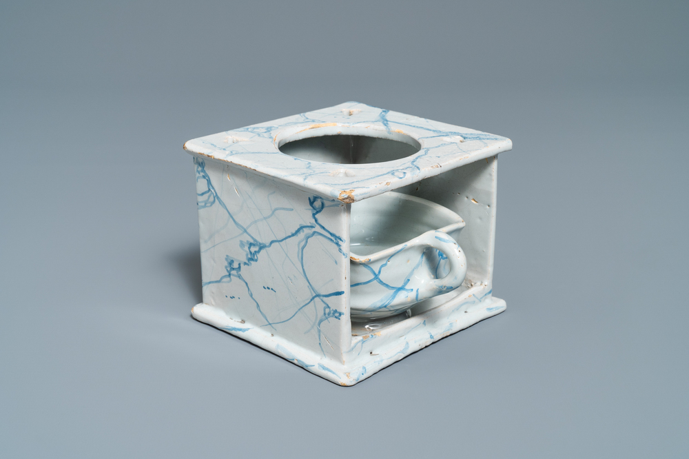 A blue and white 'faux-marbre' stove with brazier, Harlingen, 1st quarter 19th C.