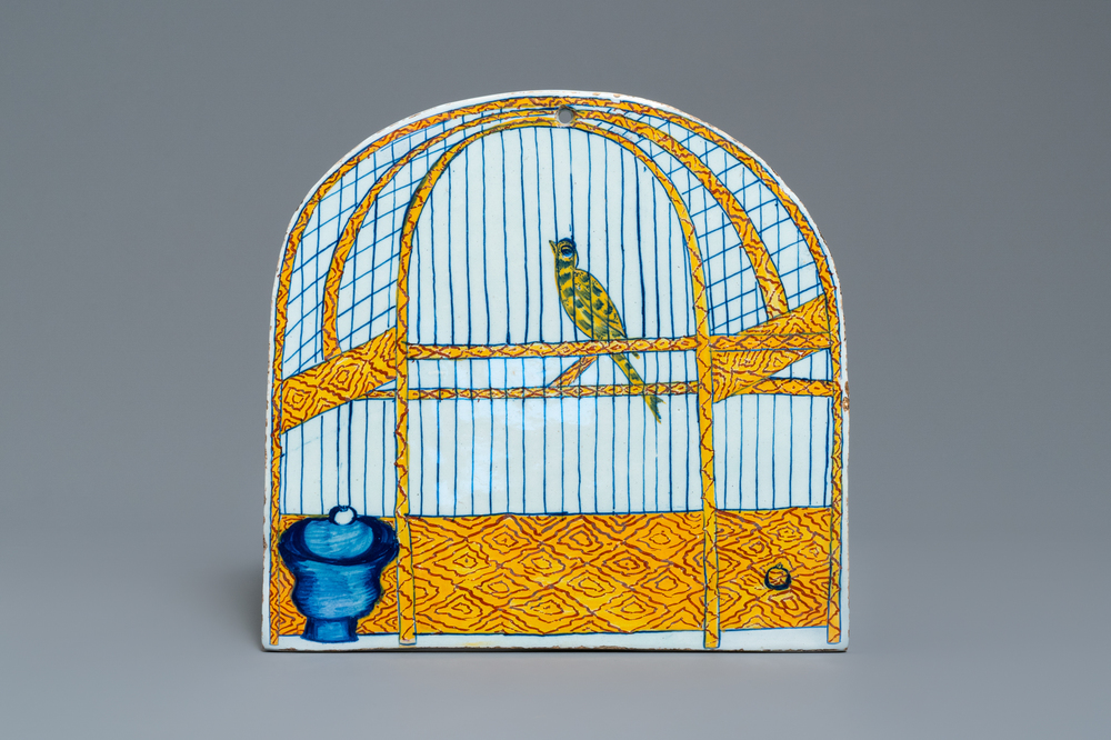 A polychrome Dutch Delft trompe l'oeil birdcage plaque, 18th C.