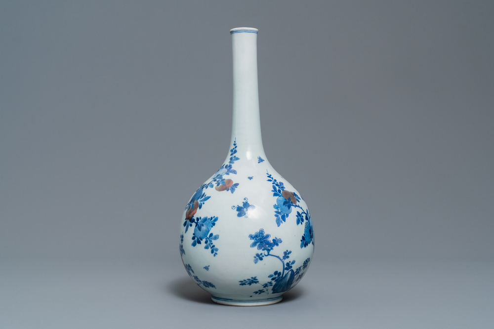 A Chinese blue, white and copper-red 'peaches' bottle vase with inscription, Kangxi