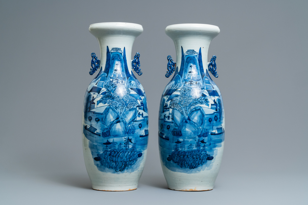 A pair of Chinese blue and white 'landscape' vases, 19th C.