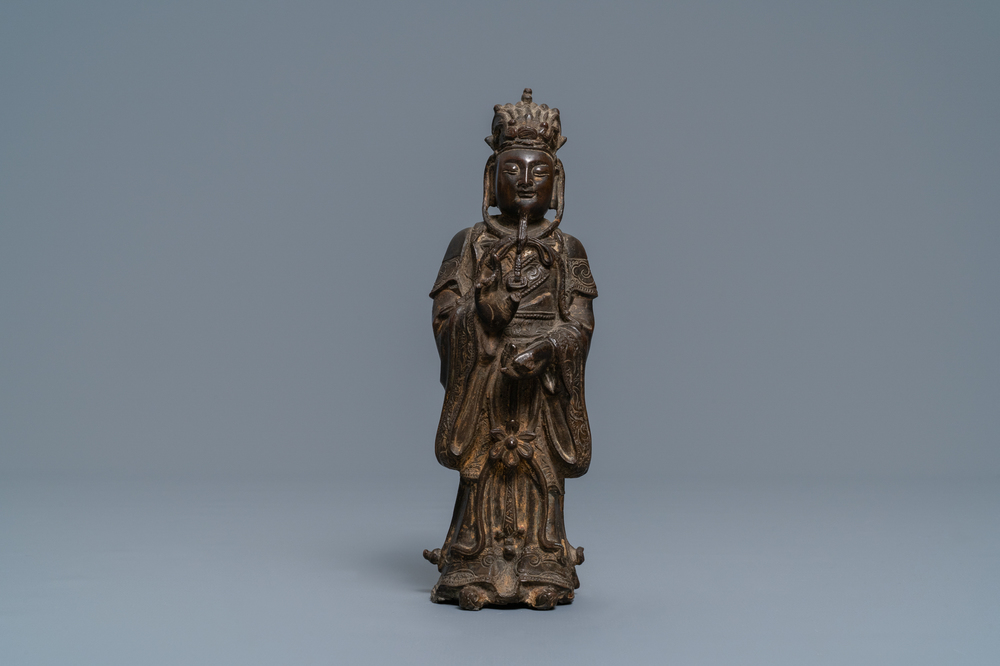 A Chinese bronze figure of a dignitary, Ming