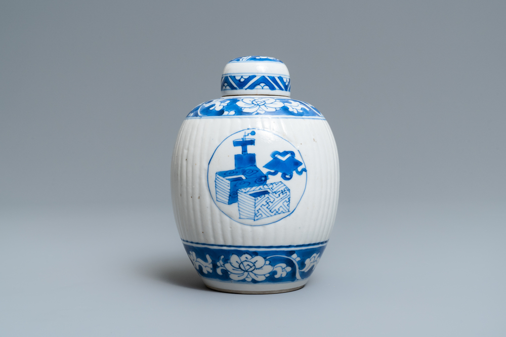 A Chinese ribbed blue and white jar and cover, Kangxi