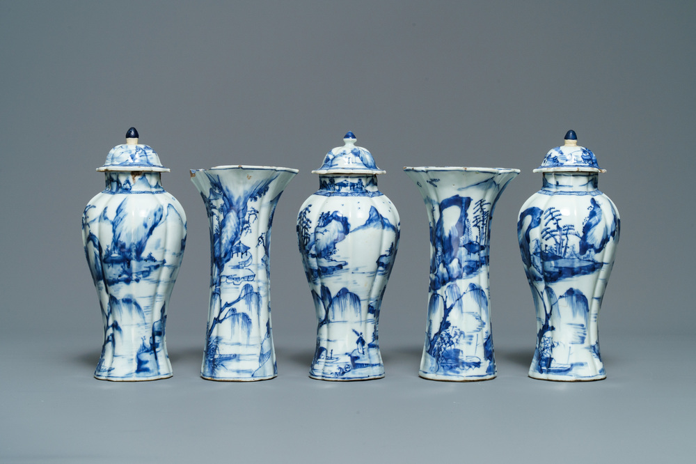 A Chinese blue and white five-piece 'landscape' garniture, Kangxi