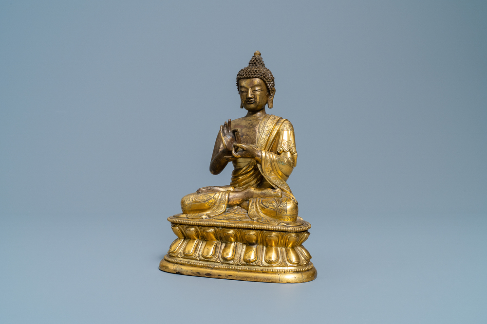 A Chinese gilt bronze figure of Buddha, 17th C.