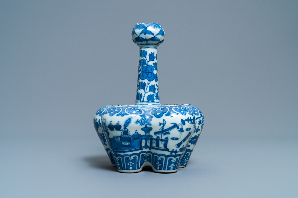 A Chinese blue and white tulip vase with antiquities, 19th C