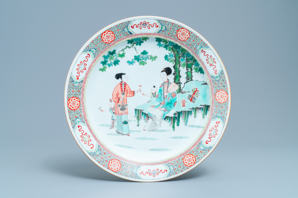 A large Chinese famille verte dish with ladies and boys in a garden, Kangxi