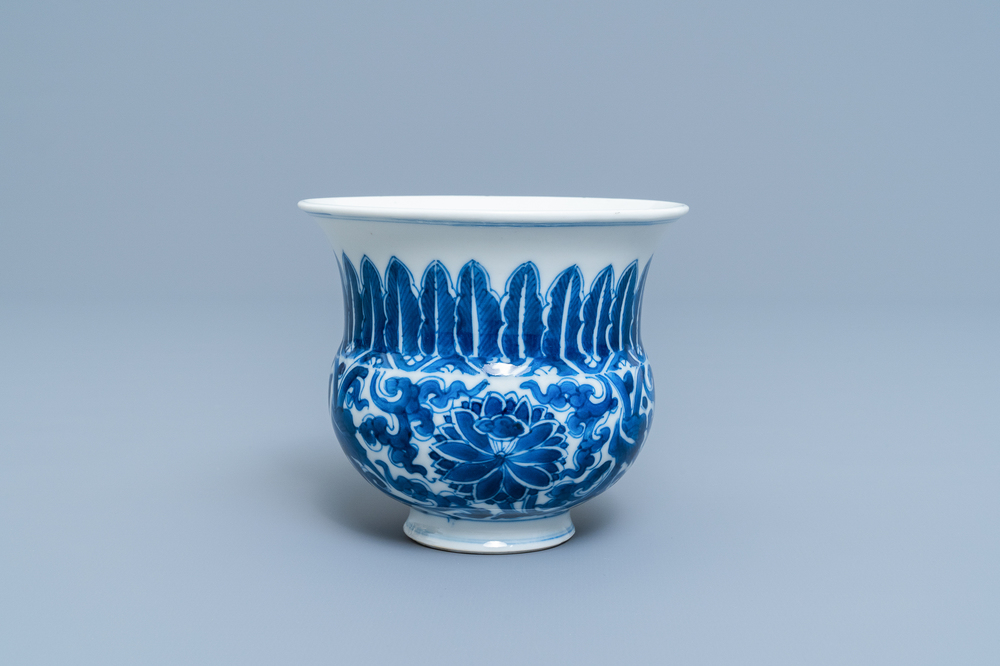 A Chinese blue and white 'lotus scroll' spittoon or zhadou, Kangxi