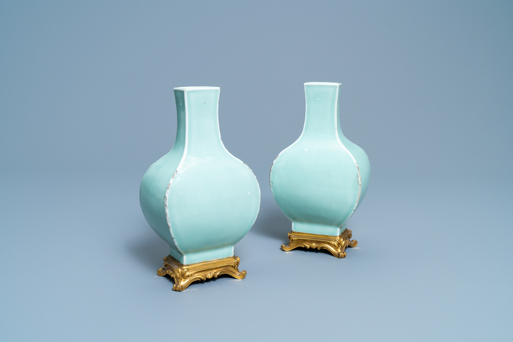 A pair of Chinese monochrome celadon vases with gilt bronze mounts, 18/19th C.