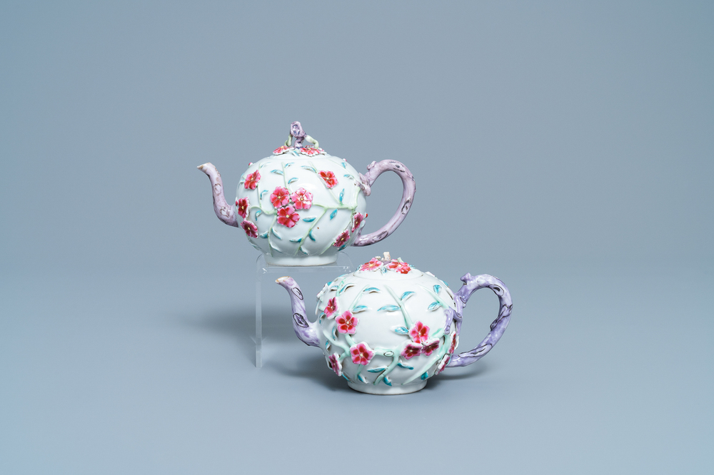 A pair of Chinese famille rose relief-decorated teapots with floral design, Yongzheng