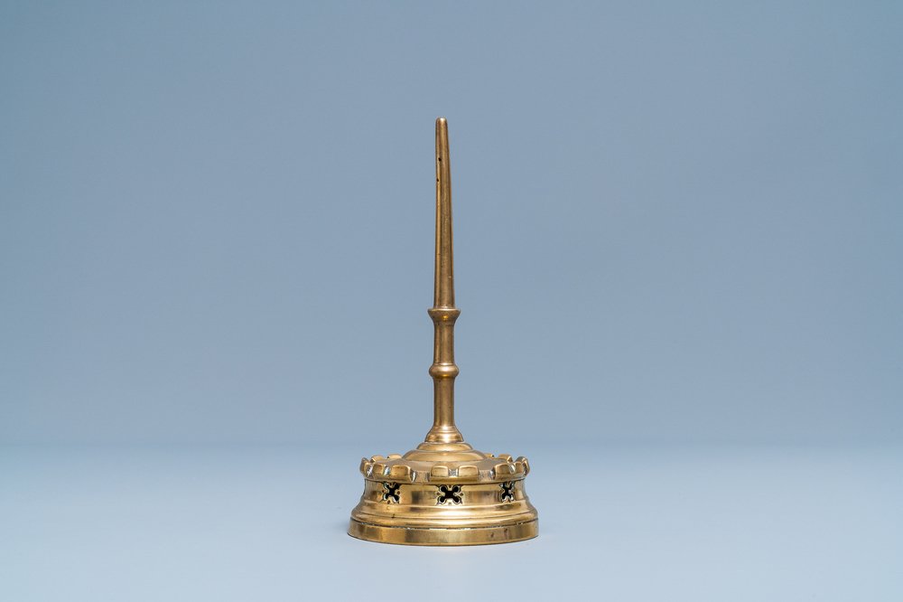 A Flemish or Dutch bronze candlestick, 14/15th C.
