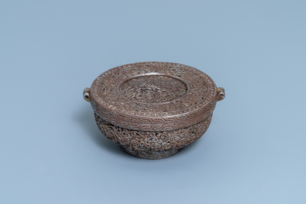A reticulated polished steel bowl and cover with dragons, Tibet, 16/17th C.