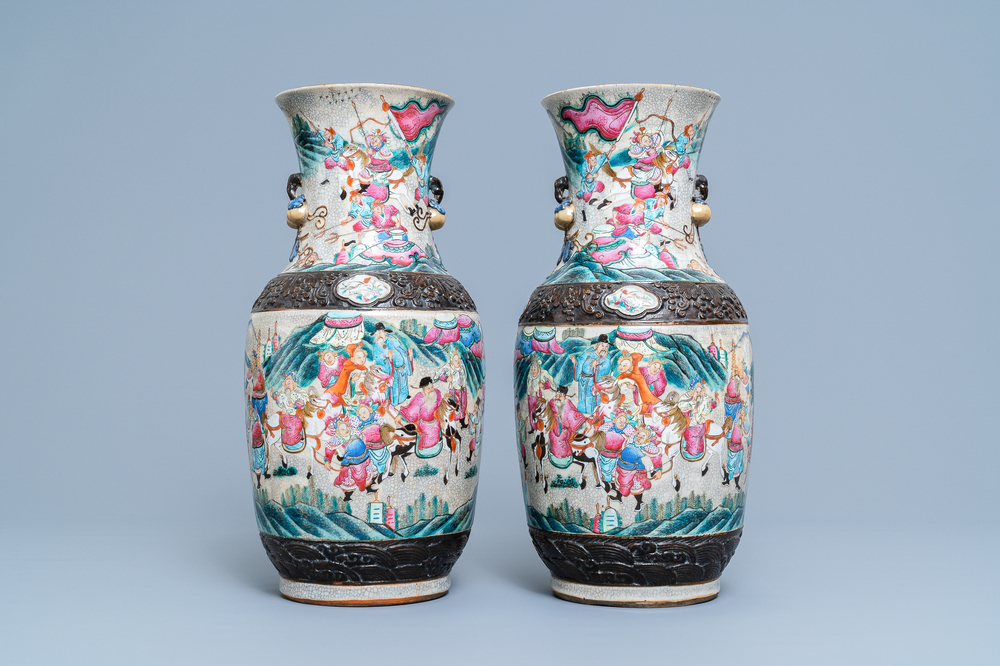 A pair of Chinese Nanking famille rose crackle-glazed 'warrior' vases, 19th C.