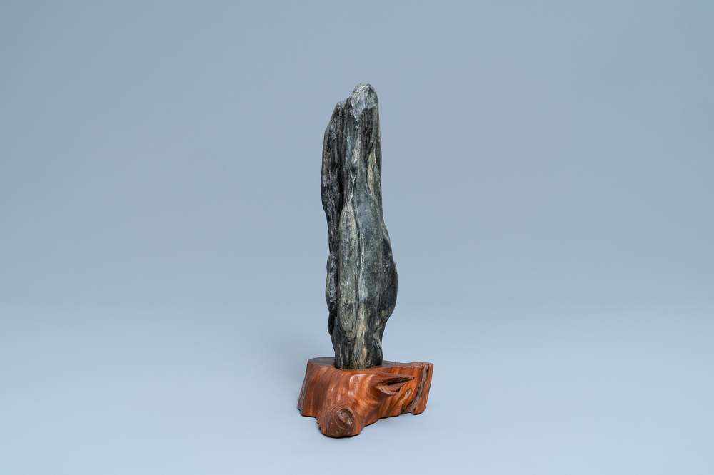 A Chinese scholar's dream stone on wooden stand, 19th C.