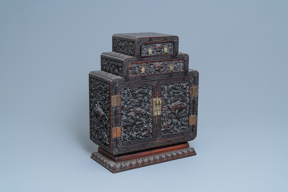 Un petit cabinet en bois sculpt&eacute; &agrave; d&eacute;cor de dragons, Chine, R&eacute;publique