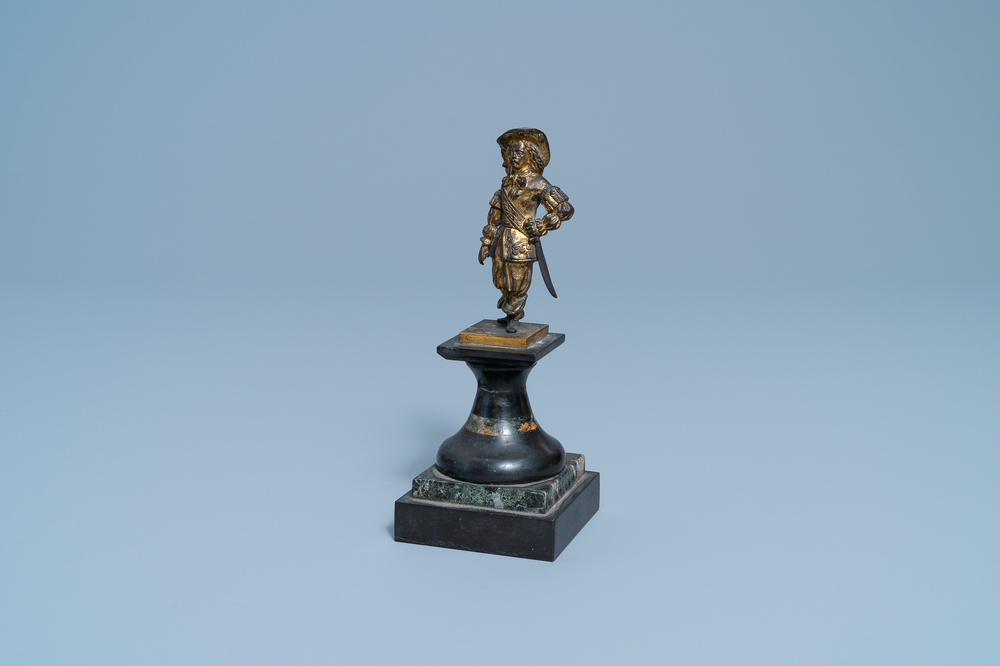 A Dutch gilt bronze model of a soldier, 17th C.