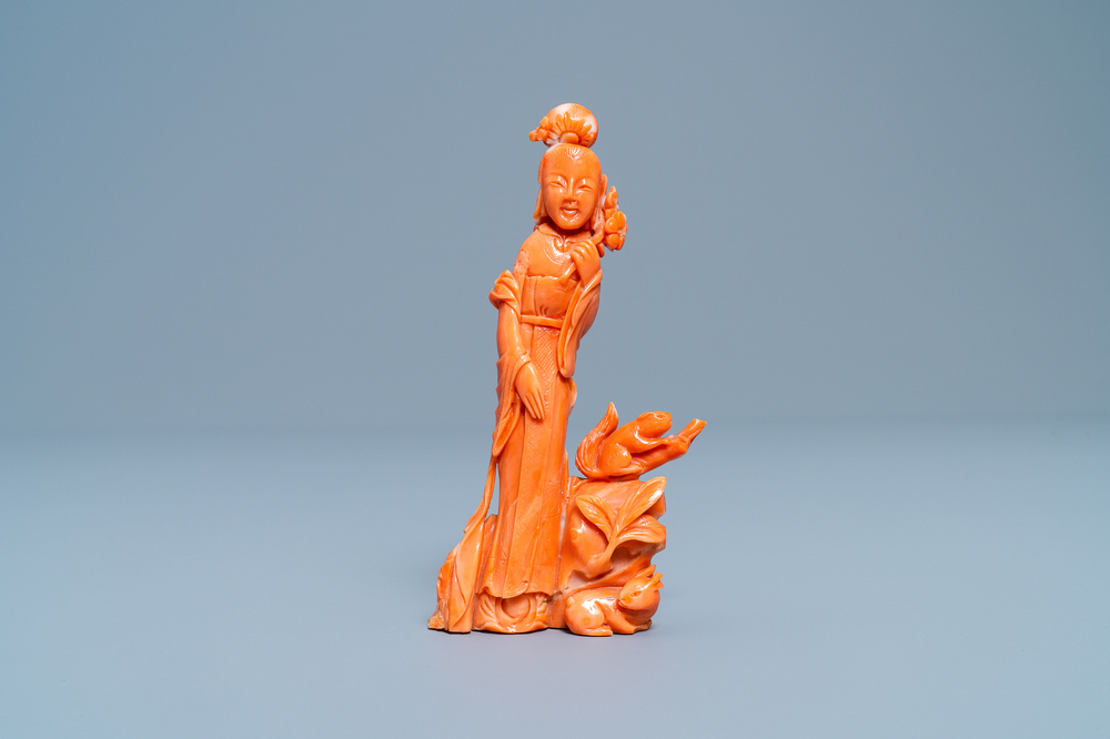 A Chinese carved red coral group of a lady, a squirrel and a rabbit, 19/20th C.