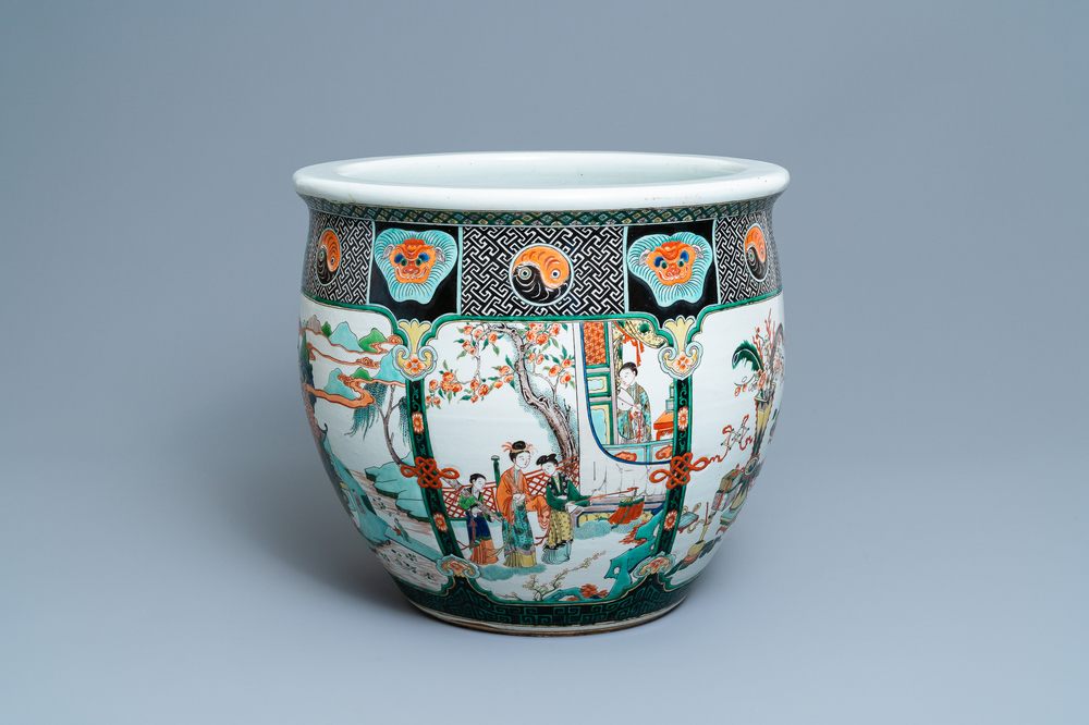 A large Chinese famille verte relief-moulded fish bowl, 19th C.