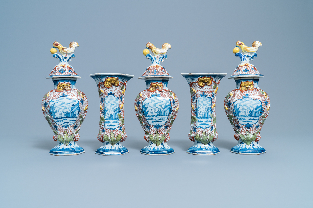 A polychrome Dutch Delft five-piece garniture with chicken-shaped finials, 18th C.