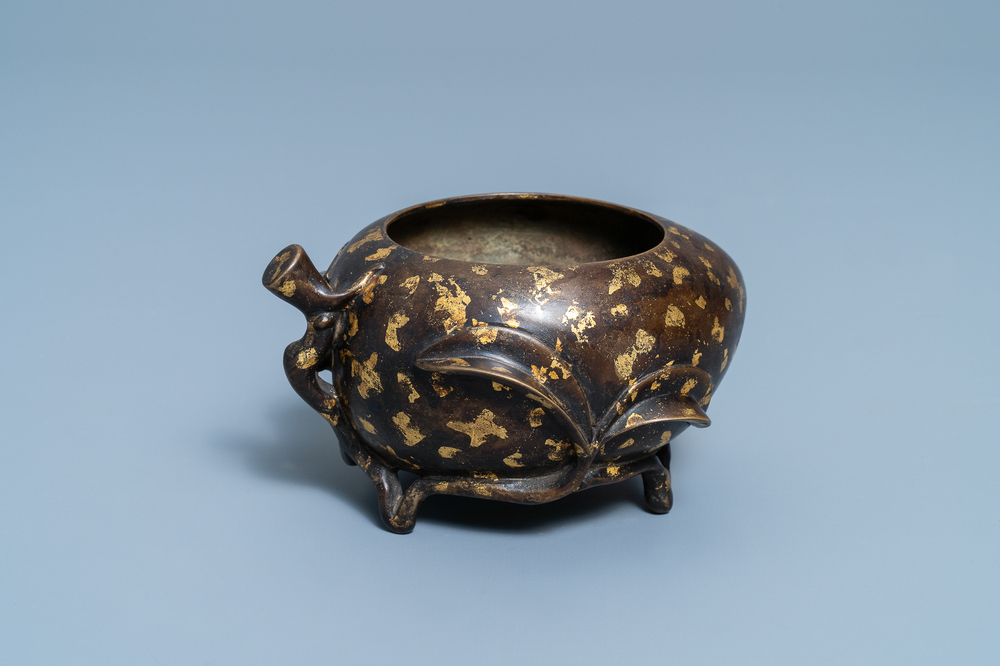 A Chinese gold-splashed bronze peach-form censer, Xuande mark, 18th C.