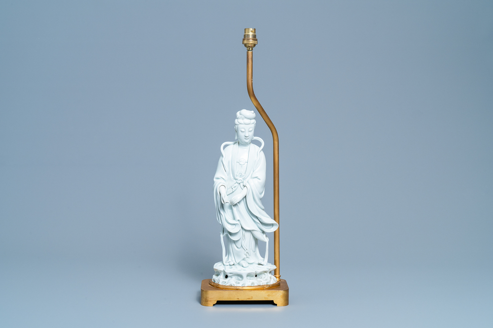 A Chinese gilt bronze lamp-mounted blanc de Chine figure of Guanyin, 19/20th C.