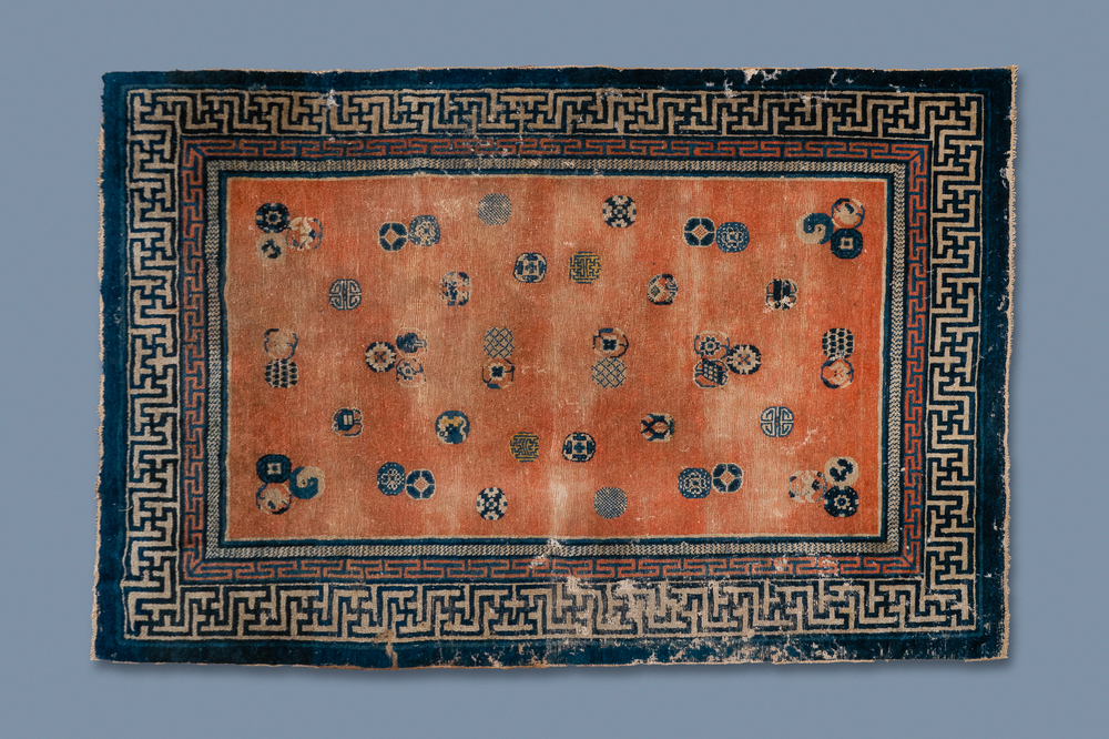 A rectangular Chinese hand-knotted wool carpet with brocade balls, 19th C.