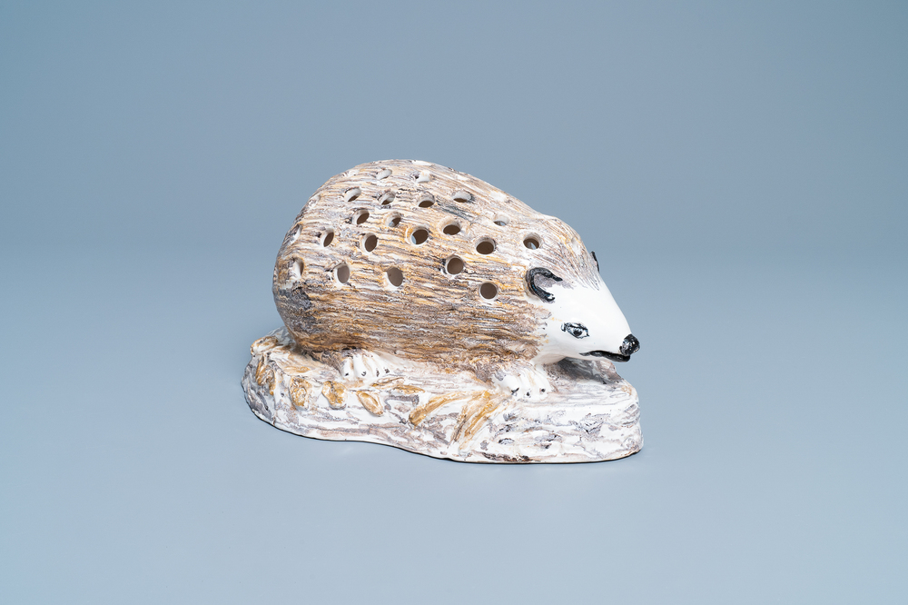 A polychrome faience flower holder shaped as a hedgehog, Northern France, 18/19th C.