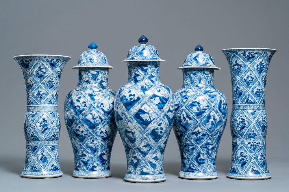 A large Chinese blue and white five-piece garniture with floral and landscape panels, Kangxi