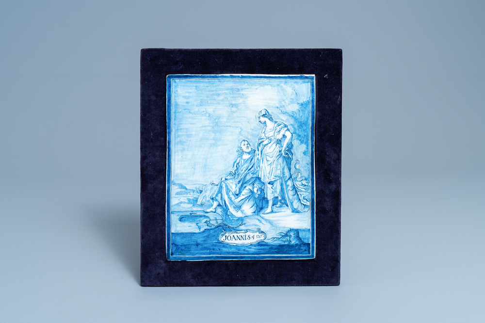 A rectangular Dutch Delft blue and white plaque with Christ meeting the Samaritan woman, dated 1767