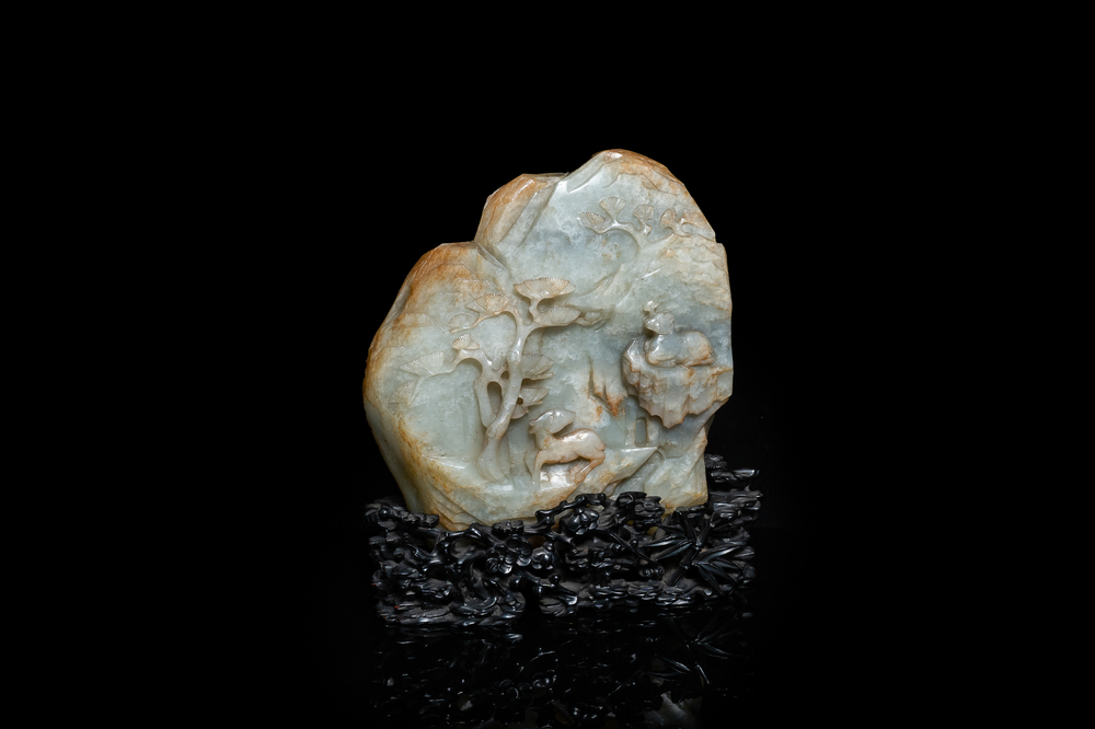 A Chinese celadon and russet jade mountain landscape with deer and cranes, Qing