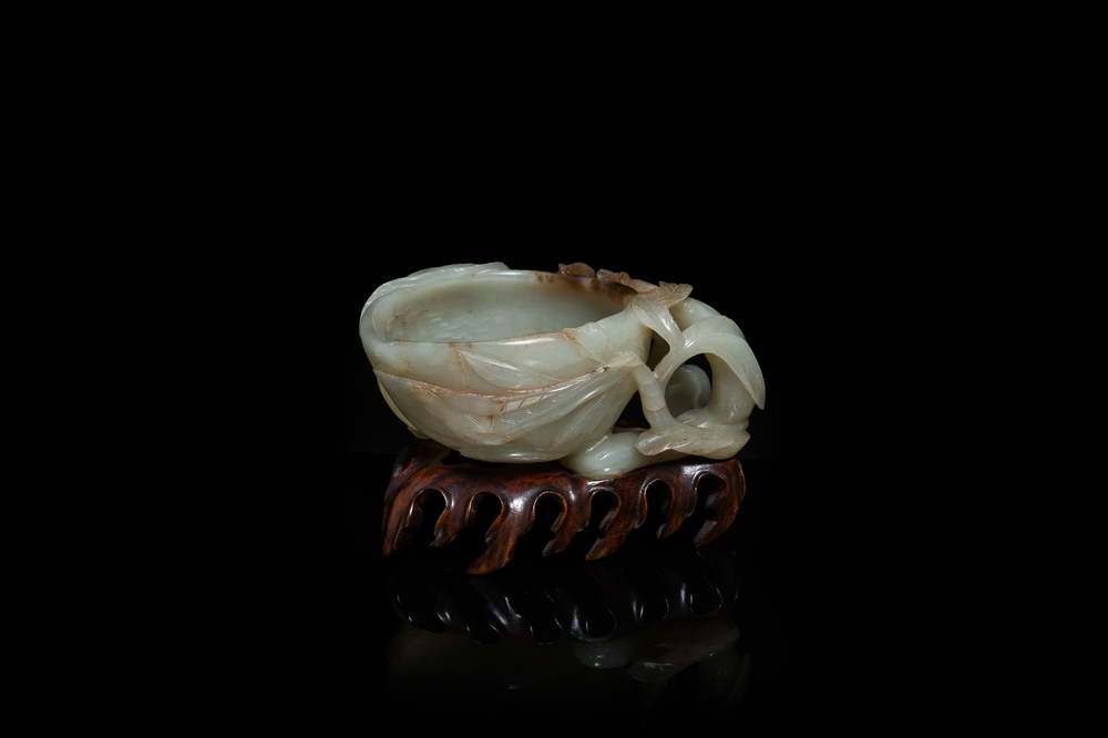 A Chinese mottled celadon and brown jade peach-form brush washer, Qing