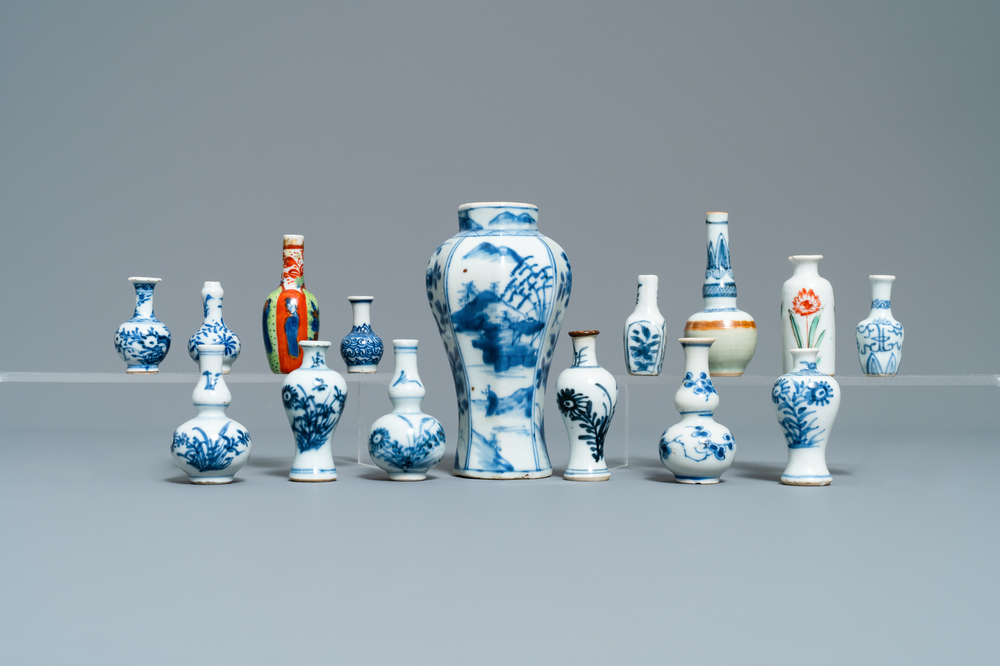Fifteen Chinese mostly blue and white miniature vases, Kangxi