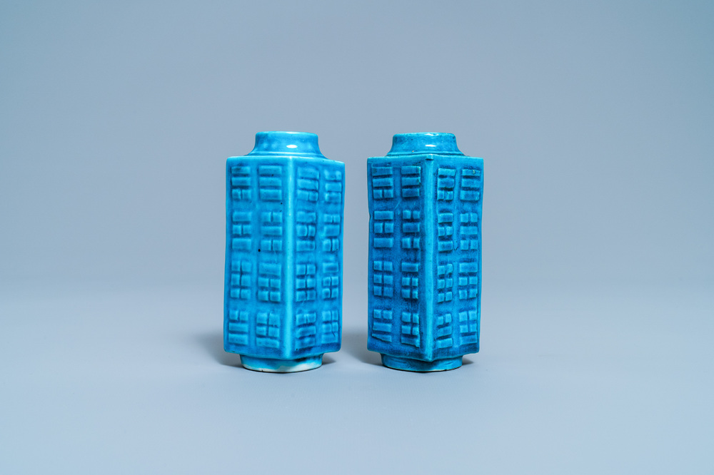 A pair of Chinese monochrome turquoise 'cong' vases with trigrams, 19th C.