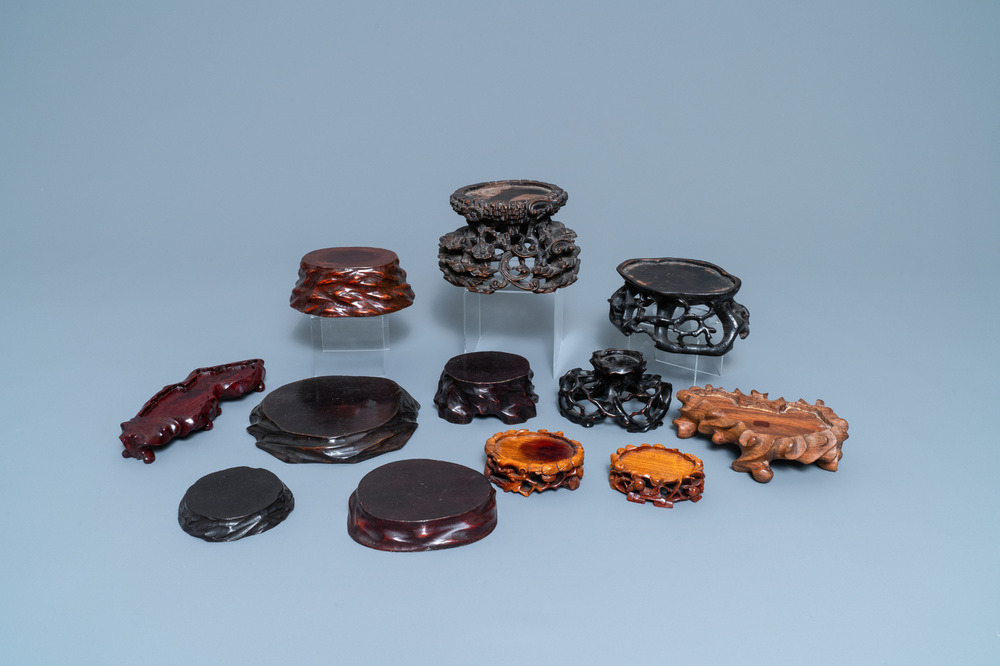Twelve Chinese carved wooden stands, 19/20th C.