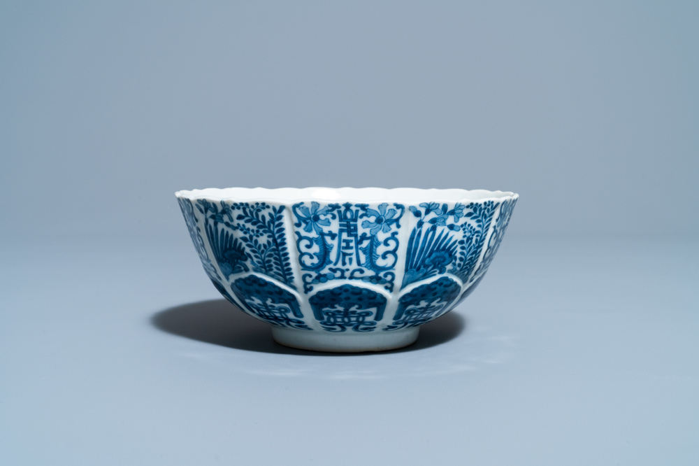 A Chinese blue and white lotus-molded bowl, Jiajing mark, 19th C.