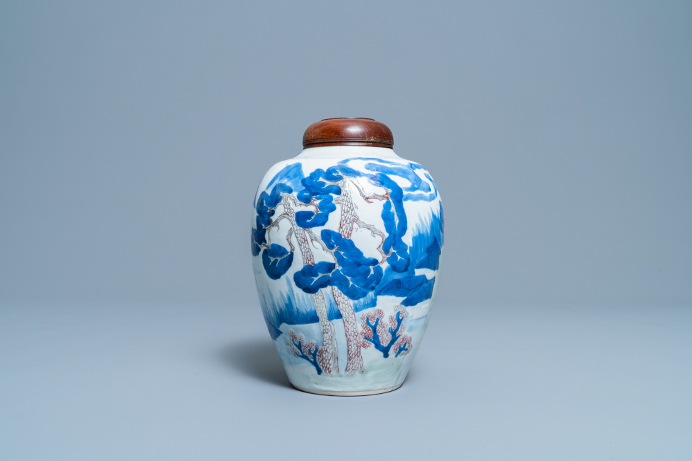 Een Chinese blauw-witte, koperrode en celadon vaas met landschapsdecor, Kangxi