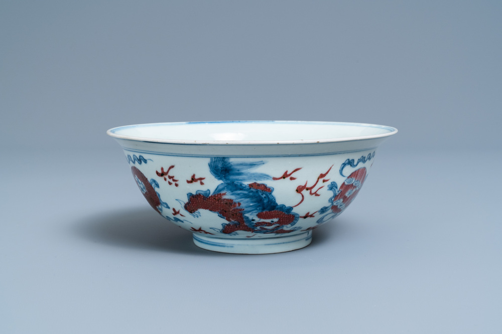 A Chinese blue, white and copper red bowl with Buddhist lions, Qianlong mark, 19th C.