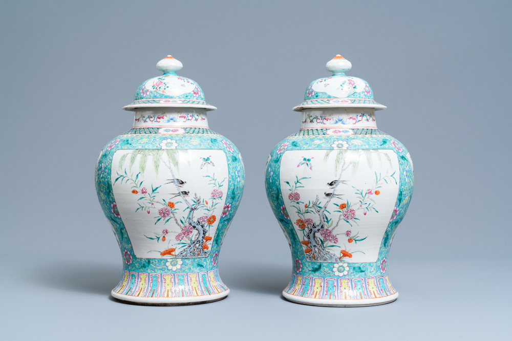 A pair of Chinese famille rose vases and covers, 19th C.