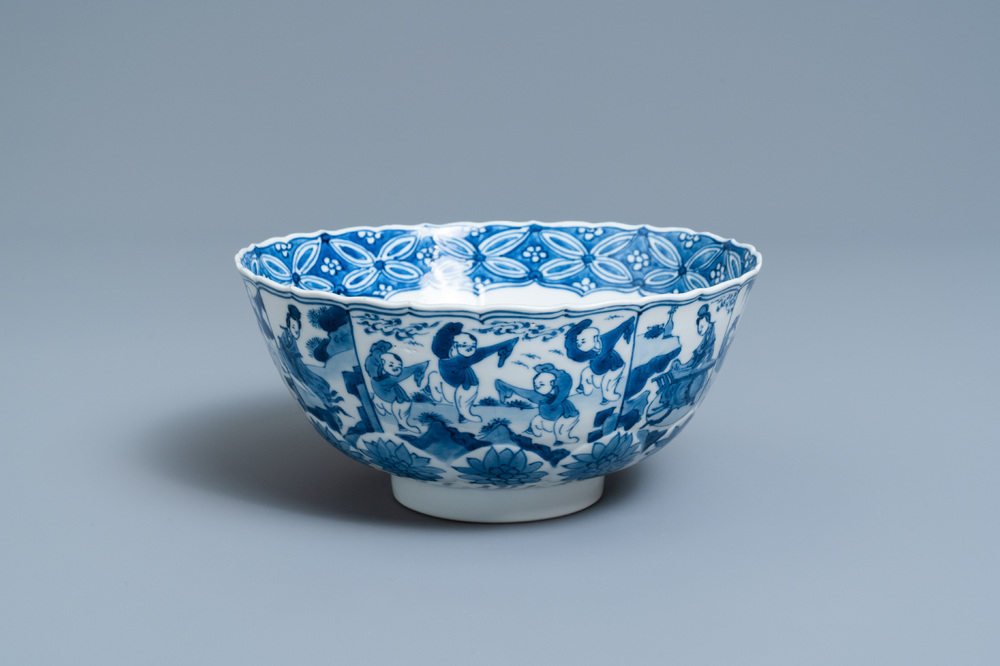 A Chinese blue and white lotus-molded 'playing boys' bowl, Chenghua mark, Kangxi