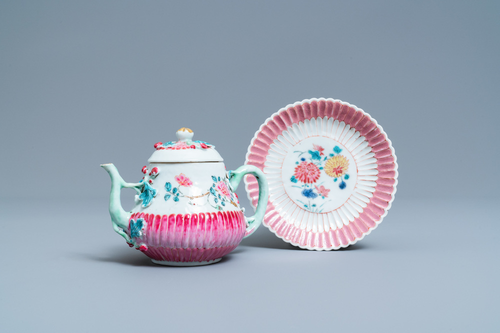 A Chinese famille rose teapot on stand with applied floral design, Yongzheng