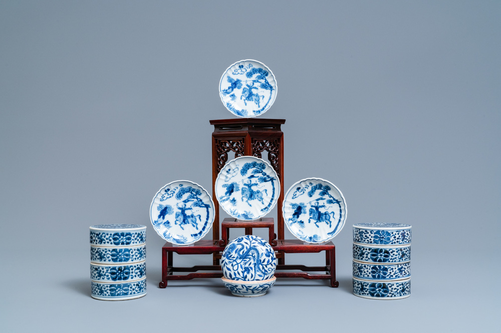A pair of Chinese blue and white four-tier stacking boxes, a seal paste box and four saucers, 19th C.