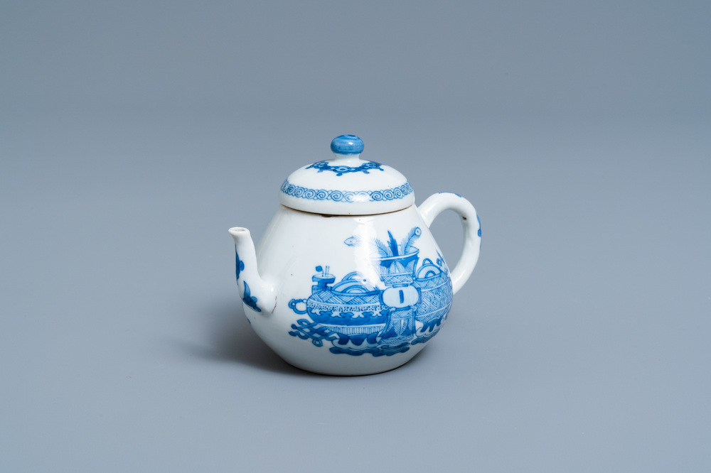 A Chinese blue and white teapot and cover with antiquities, Jiajing mark, Kangxi