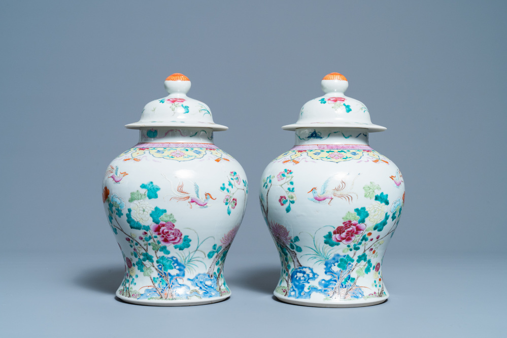 A pair of Chinese famille rose vases and covers, 19th C.