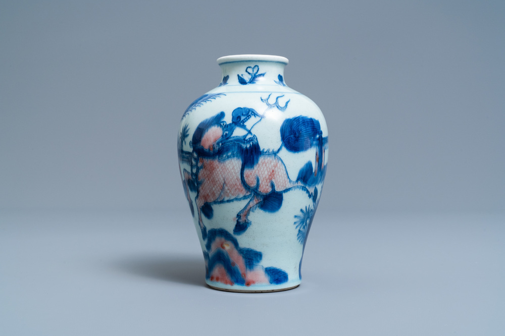 A Chinese blue, white and copper red 'qilin and phoenix' vase, Qing