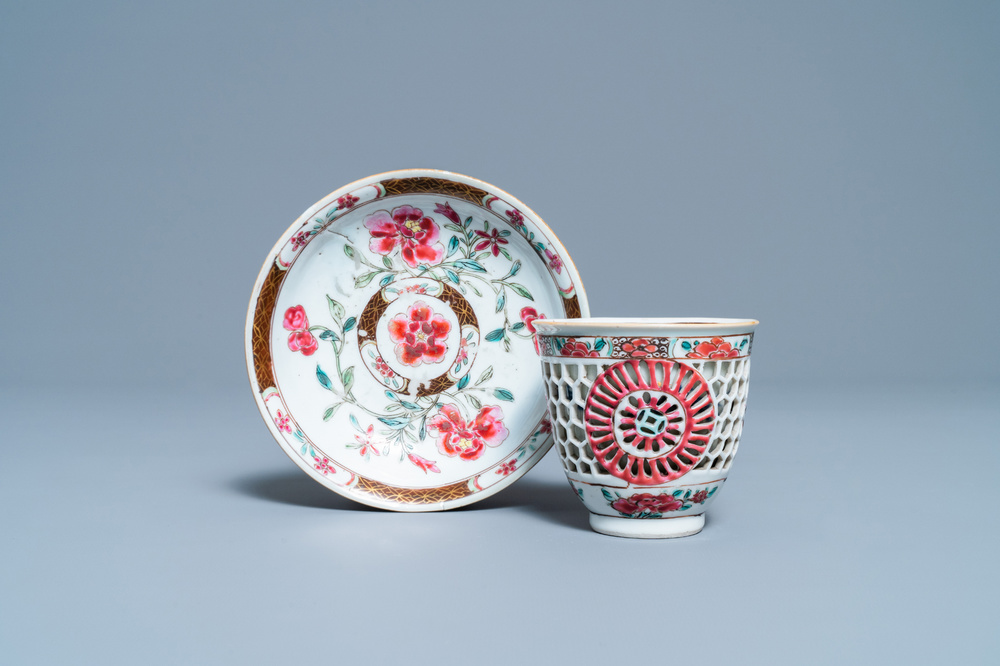 A Chinese reticulated double-walled famille rose cup and saucer, Yongzheng