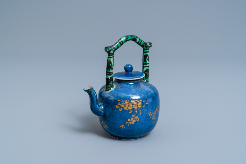 A Chinese powder blue and gilt teapot with verte biscuit handle, Kangxi